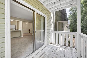 A view of a house's deck and patio area.